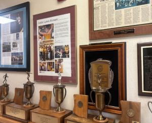 Pictured are cases of articles written about the work Sister Lynn Winsor has done at Xavier. These articles featured from “Arizona State University Alumni” and “The Catholic Sun” are displayed in the athletics office.
