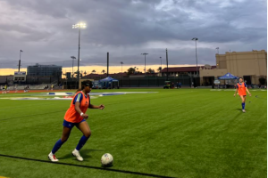 Myriam Lawrence ‘26 practices drills before a game against Salpointe Catholic High School. The team does warmup kicks to prepare for the game.