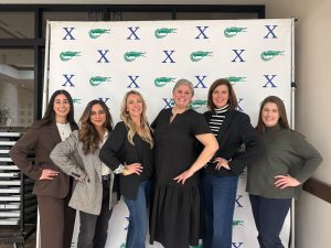Kate Schillinger, Melanie Burm, Soraya Ghebleh, Laura Chapman, Stephanie Hajjar and Joy Haugen pose at the Leading Ladies Luncheon. These women served as panelists for other Xavier alumnae, speaking about their experiences in business.