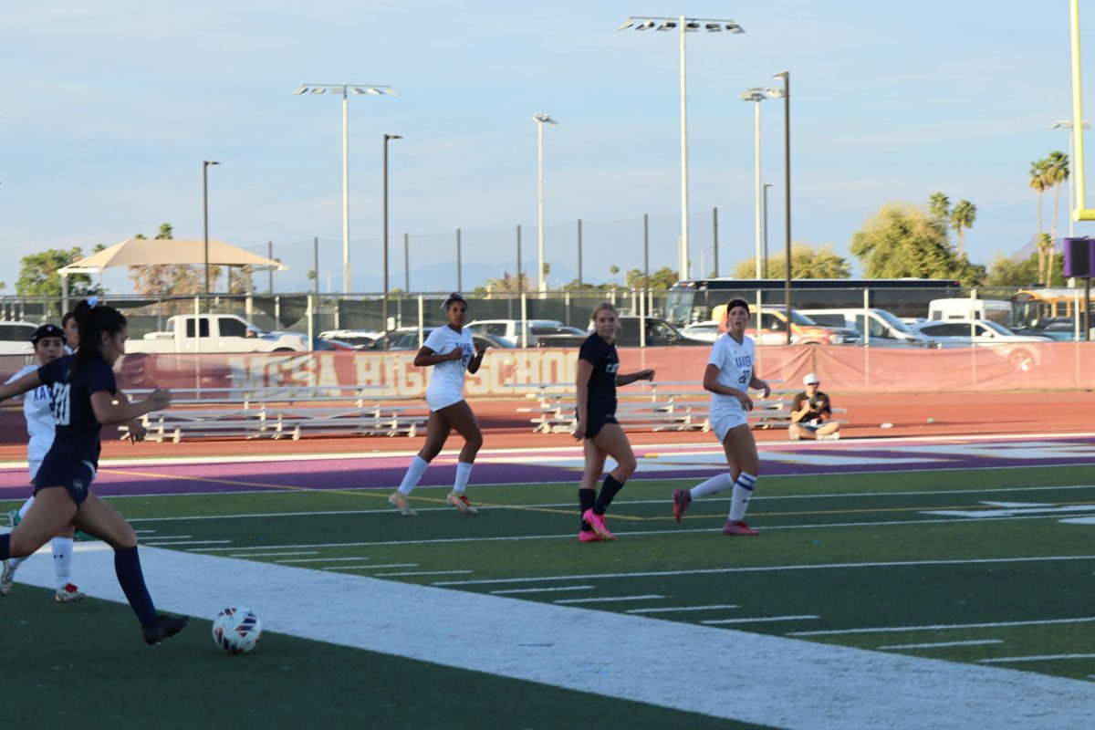 Nev Herzog ‘26 and Bianca Willis ‘26 watch the ball as the opposing team plays the ball. The Gators are in the first half, and the score is 0-0.
