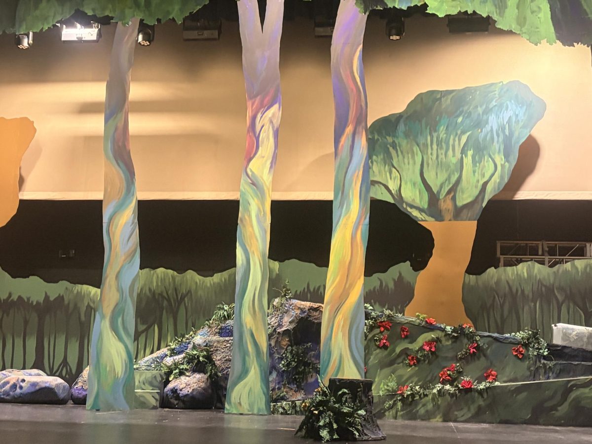 The set design for “Into the Woods” includes hand-painted scenery that brings the stage to life as a living canvas. The artistic design takes inspiration from the Post-Impressionist movement to create a different world for the musical.