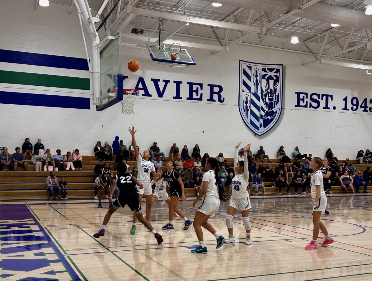 Xavier's JV basketball team competes in a tough game against Millennium. The teams played each other on Feb. 11, 2026, ending with a score of 76-41 and a win for Millennium.