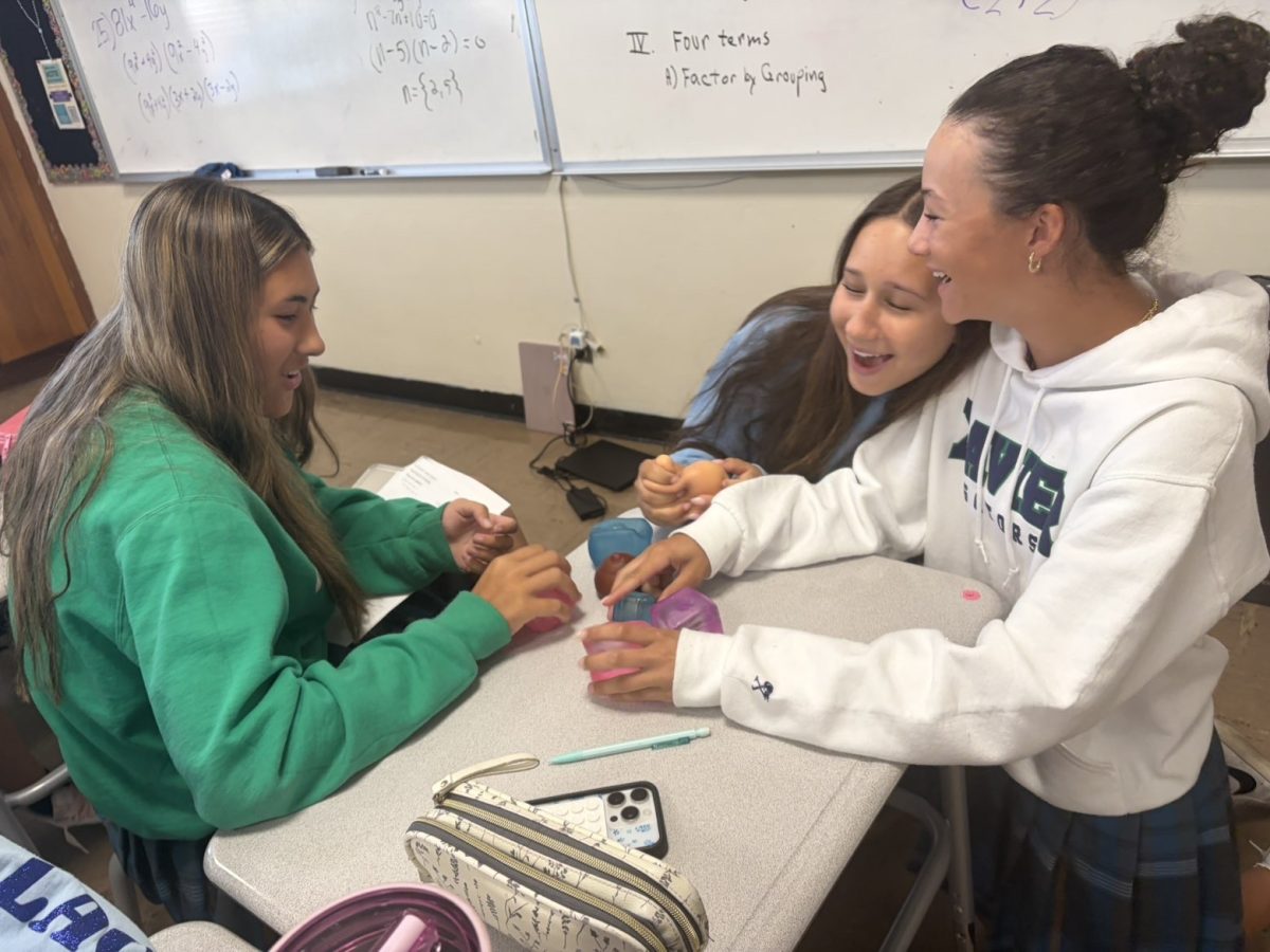 Ali Mitchell ‘29, Gillien Mickelson ‘29 and Harper Grove ‘29 are seen in math class playing with NeeDohs. Many students have fun with the different types.