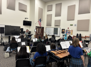 Beginning Band students practice together during class. The musicians learn more about their instruments and playing as a group.