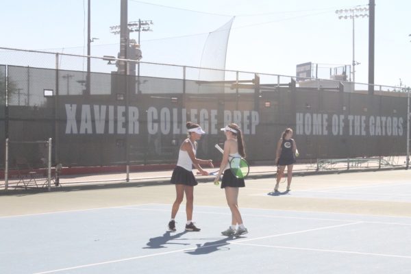 Harper Grove ‘29 and Leighton Champagne ‘28 practice on Wednesday, March 25. The tennis team prepares for its upcoming matches while focusing on team growth.