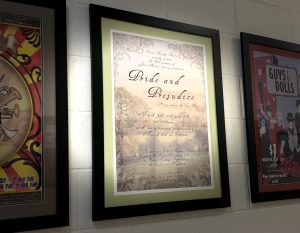 A framed poster from a past production of “Pride and Prejudice” hangs in the spotlight in the Performing Arts Center hallway at Xavier College Preparatory. The school’s fine arts department recently announced it will revisit the Jane Austen classic, alongside a production of Disney’s “Frozen.” 