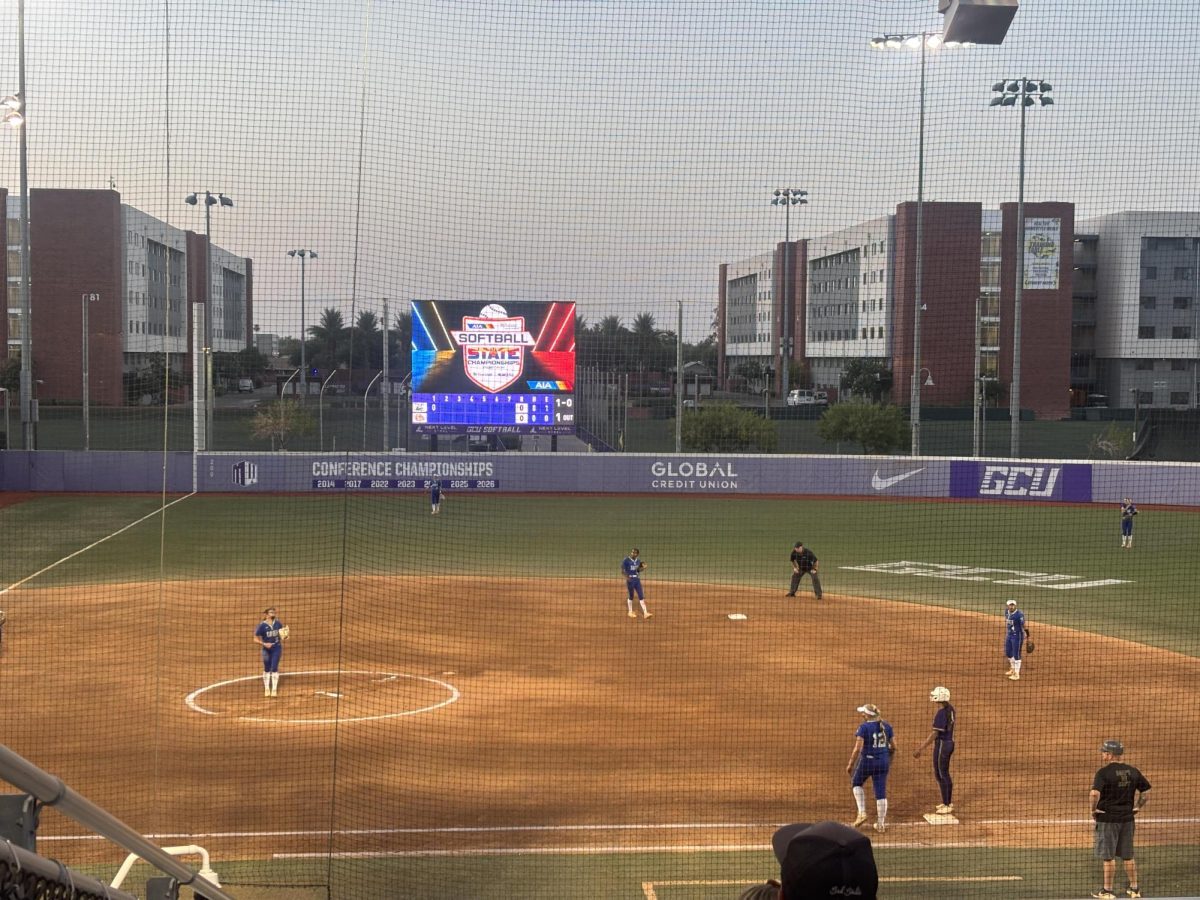 Playing at GCU Softball Stadium, Xavier won its third 6A softball state championship in a row against Queen Creek with a score of 6-0 on May 18. Infielders Sydney Root ’28, Sariah McNabb ’27, Makenzie Latvaaho ’27 and Sophia Jaramillo ’29 are conversing about their following play as they prepare for the upcoming batter.