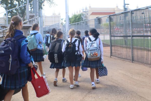 Xavier's swim & dive team walk to Brophy's Aquatic Center to practice after finishing the school day. This is the team's final practice before the first meet of the season.