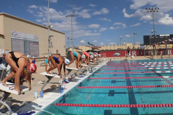 The swim team begins practice at the BCP pool by demonstrating proper form on the track stop block. They do this in preparation for the first swim meet of the season.