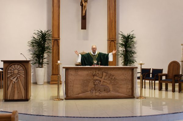 Father Chris Cartwright celebrates morning Mass in the Chapel of Our Lady on Friday, September 11. Cartwright is Xavier’s new chaplain and will serve the community by guiding and supporting students in their faith. 