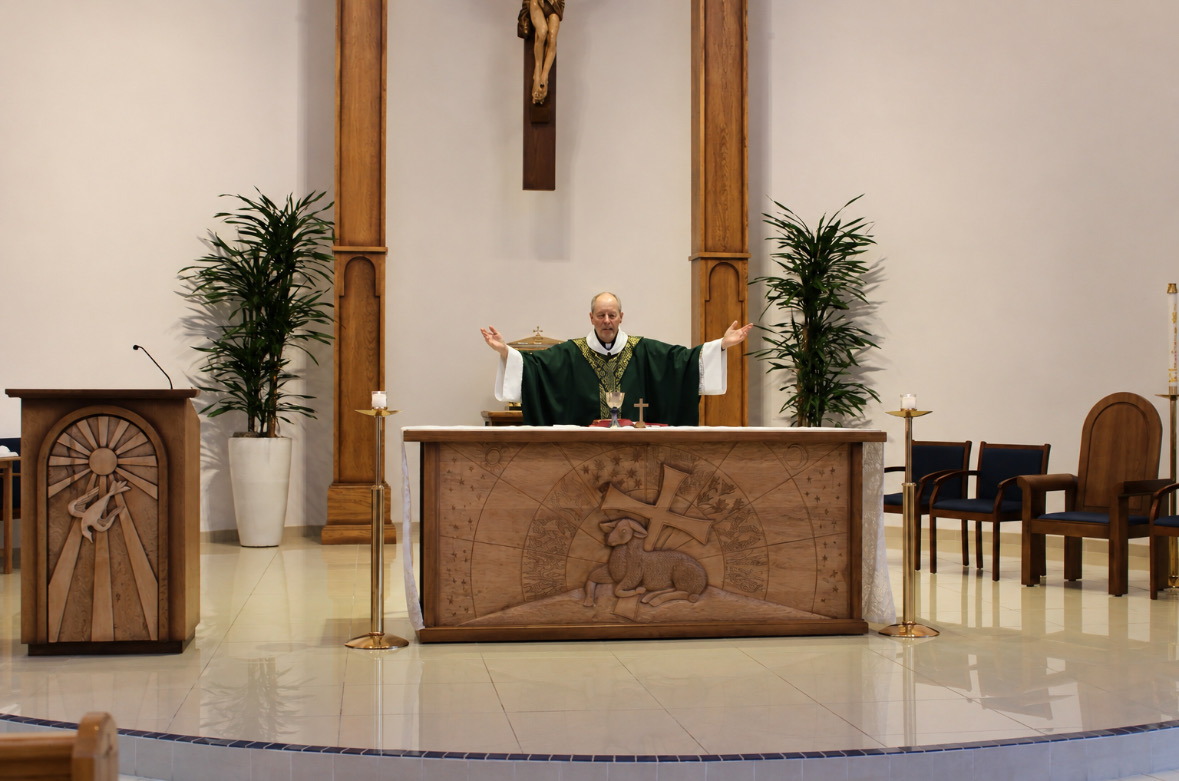 Father Chris Cartwright celebrates morning Mass in the Chapel of Our Lady on Friday, September 11. Cartwright is Xavier’s new chaplain and will serve the community by guiding and supporting students in their faith.