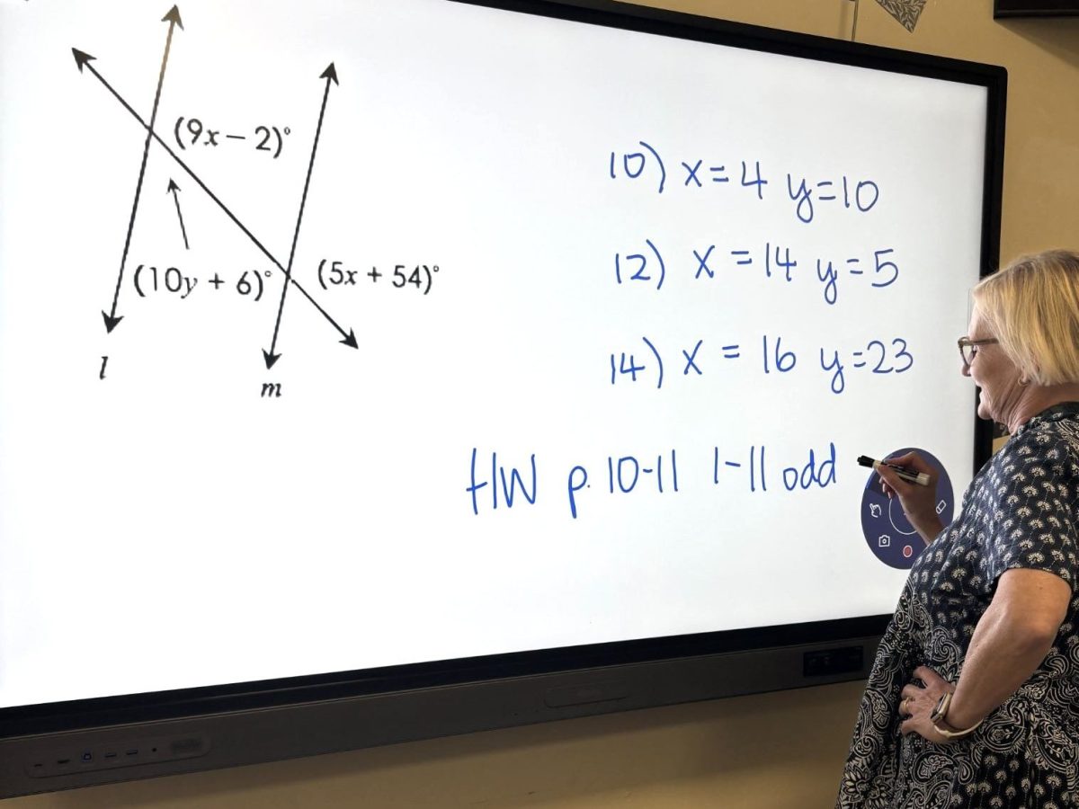 Geometry teacher Deborah Seaquist teaches her students how to solve for angles formed by intersecting lines. On a BenQ Smart Board, she helps them understand the lesson and prepares them for success.