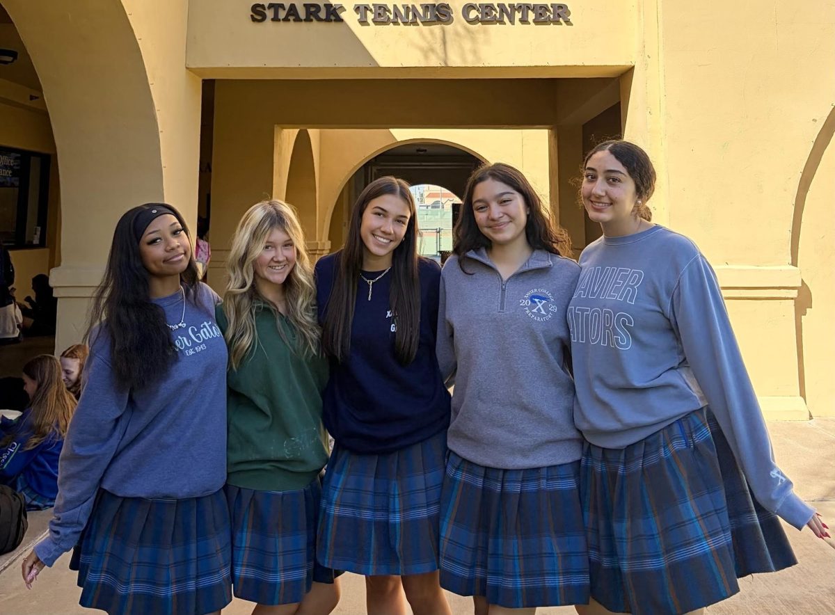 BRIDGE members gather at the iconic bell tower at Xavier College Preparatory on Friday, Oct. 2 during break. They are excited to embark on this new project. 

